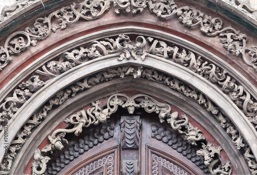 Tympanum of an old door in Prague