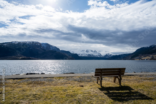 Lonely bench at the cold Norwegian fjord