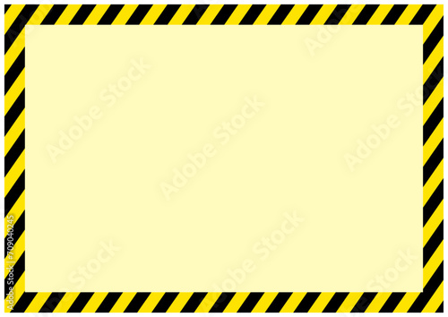 災害工事現場で使う黄色と黒の危険注意の警告フレーム枠縦薄黄色 photo