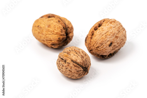 Delicious whole walnuts, isolated on white background