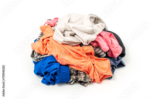 Textile ready to recycle, isolated on white background. Heap of used colorful clothes for recycling
