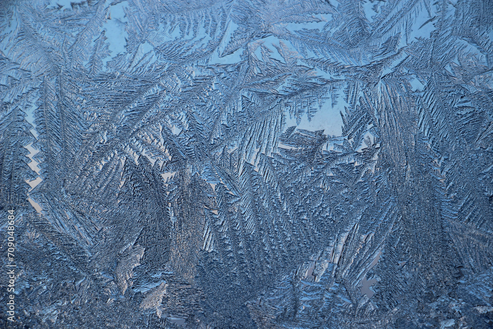 Winter frosty patterns on window glass