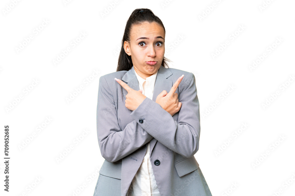Young Arabian woman over isolated chroma key background pointing to the laterals having doubts Young Arabian woman over isolated chroma key background pointing to the laterals having doubts