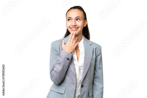 Young Arabian woman over isolated chroma key background looking up while smiling