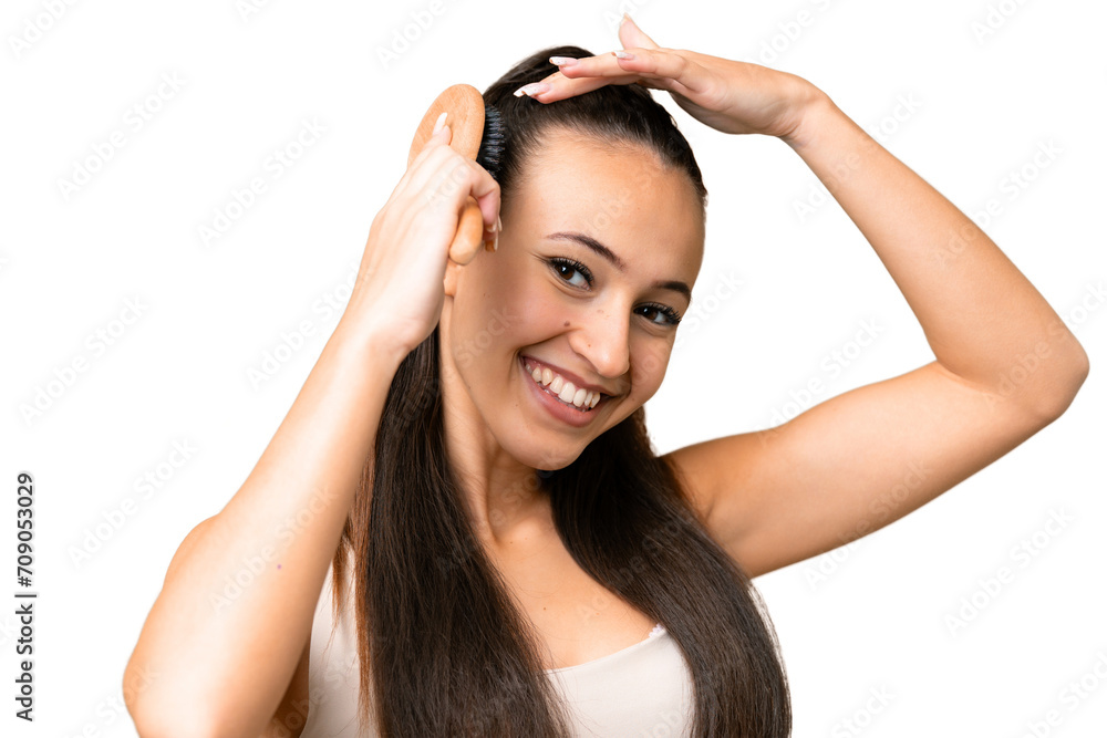 Young Arabian woman over isolated chroma key background with hair comb Young Arabian woman over isolated chroma key background with hair comb