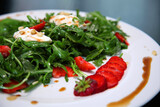 Salad with arugula, cream cheese and strawberries. Salad with arugula and strawberries. Rucola and strawberries.