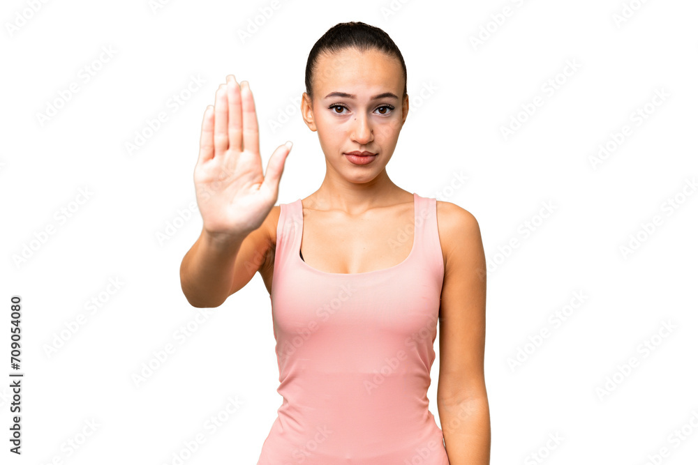Young Arab woman over isolated background making stop gesture Young Arab woman over isolated background making stop gesture