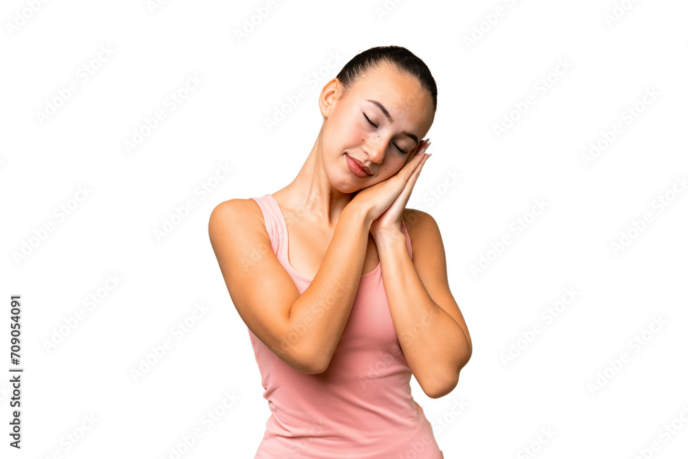 Young Arab woman over isolated background making sleep gesture in dorable expression Young Arab woman over isolated background making sleep gesture in dorable expression