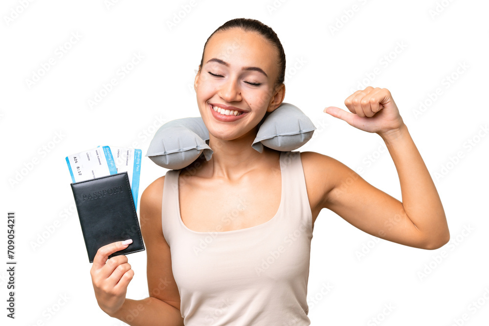 Young Arab woman with Inflatable Travel Pillow over isolated background doing strong gesture Young Arab woman with Inflatable Travel Pillow over isolated background doing strong gesture