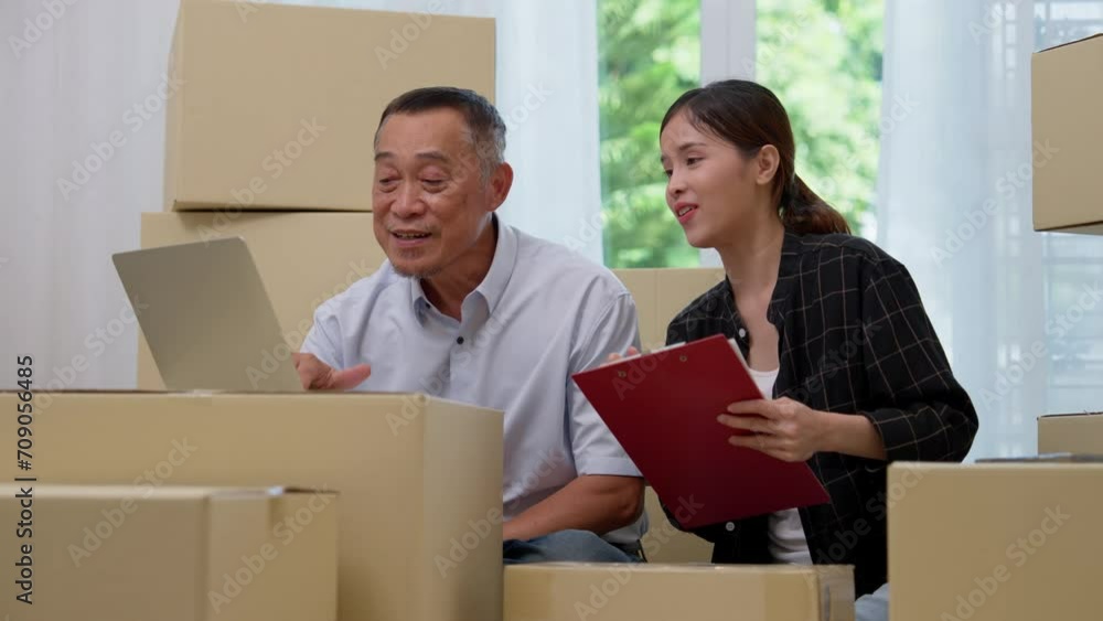 Asian elderly older using laptops and young women use smartphones for checking email order at home SMEs, Startup small business entrepreneur working online marketing after retirement, merchant concept Asian elderly older using laptops and young women use smartphones for checking email order at home SMEs, Startup small business entrepreneur working online marketing after retirement, merchant concept