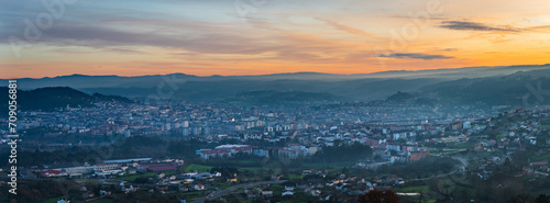 Fototapeta Naklejka Na Ścianę i Meble -  Panorama view of the skyline of the Galician city of Ourense at dusk as seen from the outskirts.