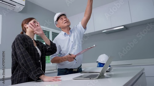 Senior home inspector checking home defects and teaching young engineers, before handing it over to client. Young engineers learn home inspection with Senior, Real estate, and renovation concepts.