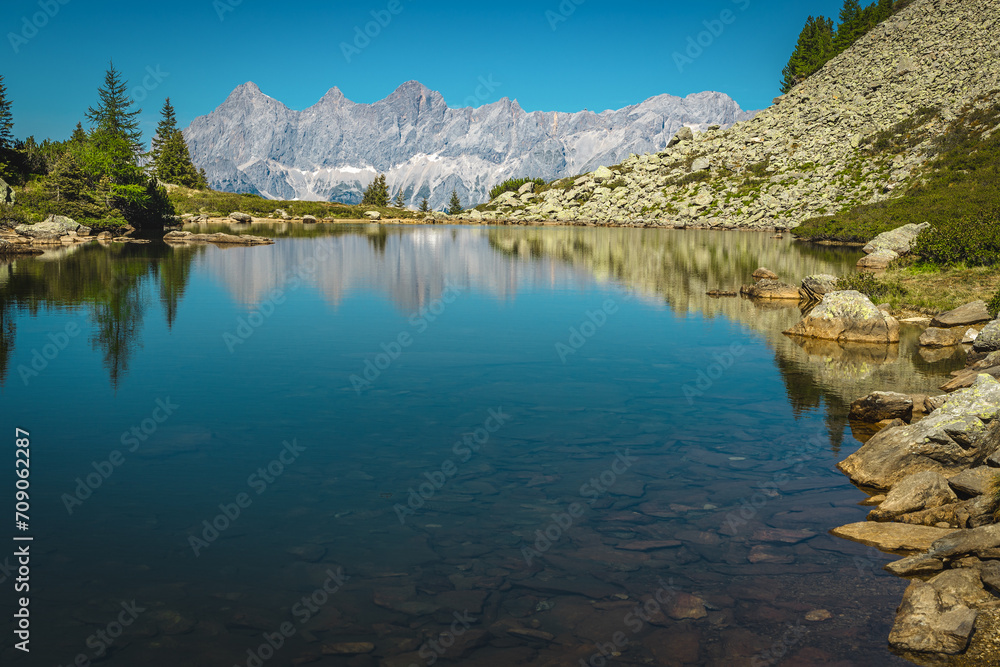 Fototapeta premium Picturesque mountain lake and high mountain ridges in Austria