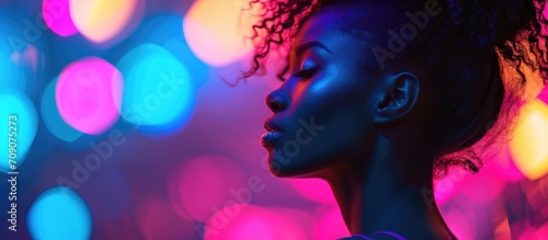 Stylish woman with vibrant neon hair in a trendy club setting. © AkuAku