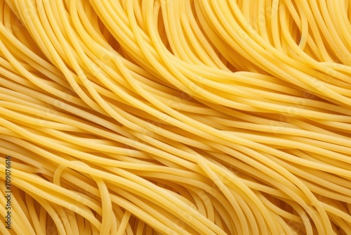 Raw spaghetti pasta as background, top view photo