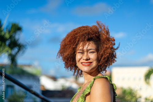Close-up portrait of the face of a beautiful woman with red hair.