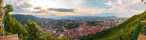 Brasov, Transylvania. Romania. Aerial panoramic view of the old town and Council Square, Aerial twilight cityscape of Brasov city
