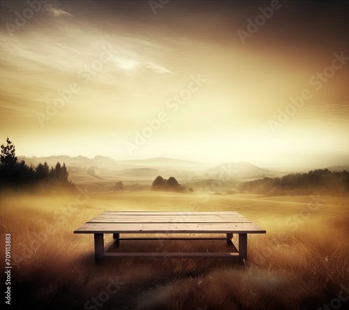 empty vintage table for product display montage with golden sunrise over misty hills