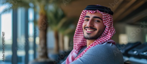 Arab athlete resting  smiling  and enjoying a healthy lifestyle after gym training.