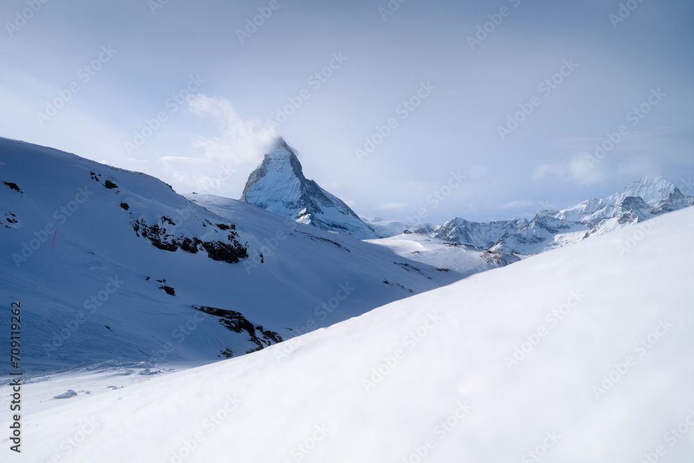Matterhorn, Switzerland. Winter mountain landscape. A place for skiing. Zermatt ski resort. High rocks and snow. View of the mountain in Switzerland.