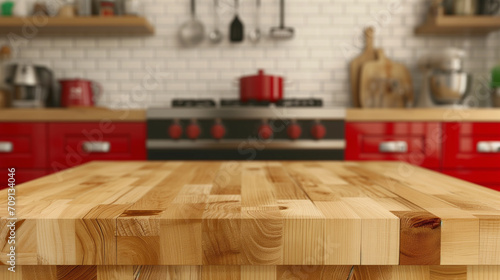 Wooden table + blurred red kitchen. Image for food blogger, ad campaign, post, banner or billboard. Bg cooking. Background of cooking in modern stylish kitchen. Wooden countertop