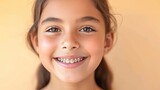 Indian beautiful young girl in braces smiles happily. Taking care of dental health, oral hygiene