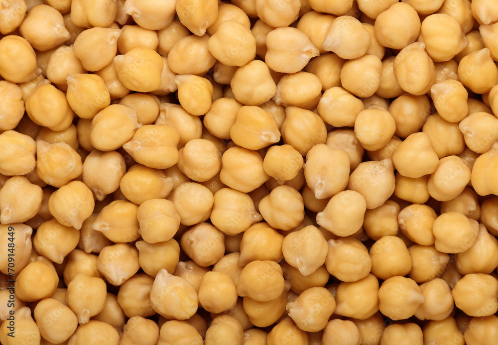 Cooked soaked chickpea beans close up background Cooked soaked chickpea beans close up background