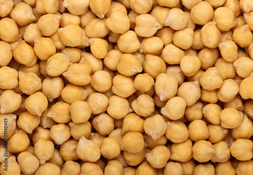 Cooked soaked chickpea beans close up background photo
