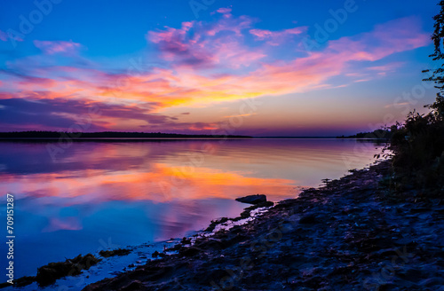 Beautiful scenic view of a vibrant sunrise over the ottawa river on a cold morning in october.