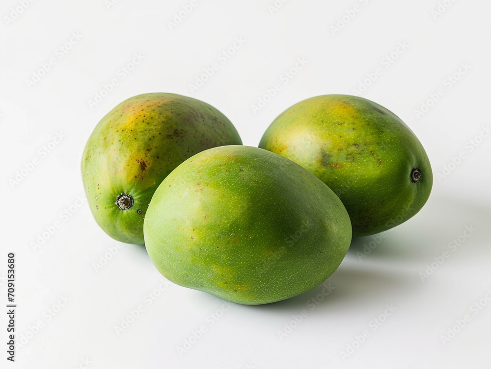 Fresh green tropical mangoes isolated on white background. Minimalist style.
Fresh green tropical mangoes isolated on white background. Minimalist style.