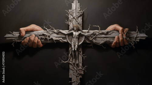 A wooden crucifix with Jesus Christ on the cross held by hands, capturing the solemnity of Holy Week photo