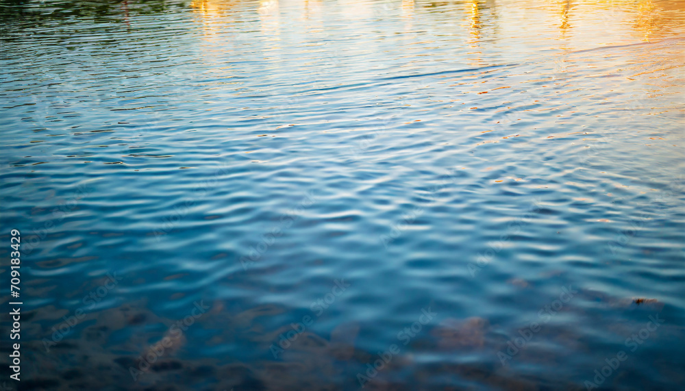 Crystal-clear water surface reflecting vibrant blue sky, symbolizing purity, tranquility, and serenity. Ideal for concepts of clarity and calmness Crystal-clear water surface reflecting vibrant blue sky, symbolizing purity, tranquility, and serenity. Ideal for concepts of clarity and calmness