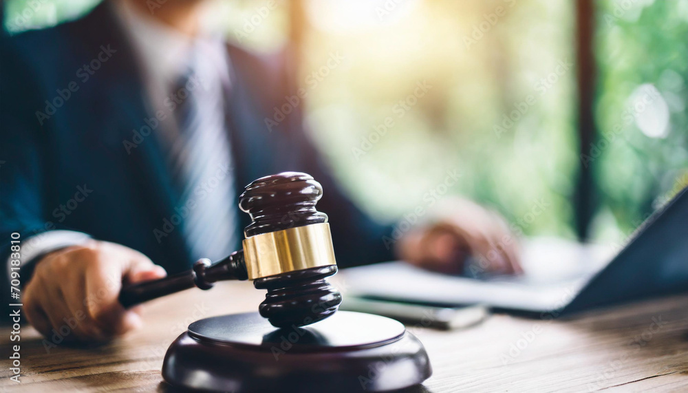 gavel resting on a wooden block, symbolizing authority and justice in a legal setting gavel resting on a wooden block, symbolizing authority and justice in a legal setting