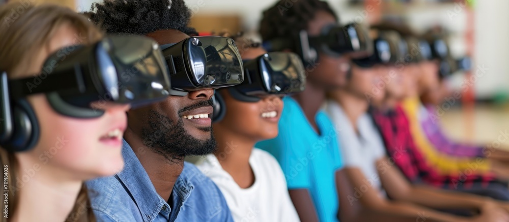 A diverse group of students with VR headsets and an African American teacher present.