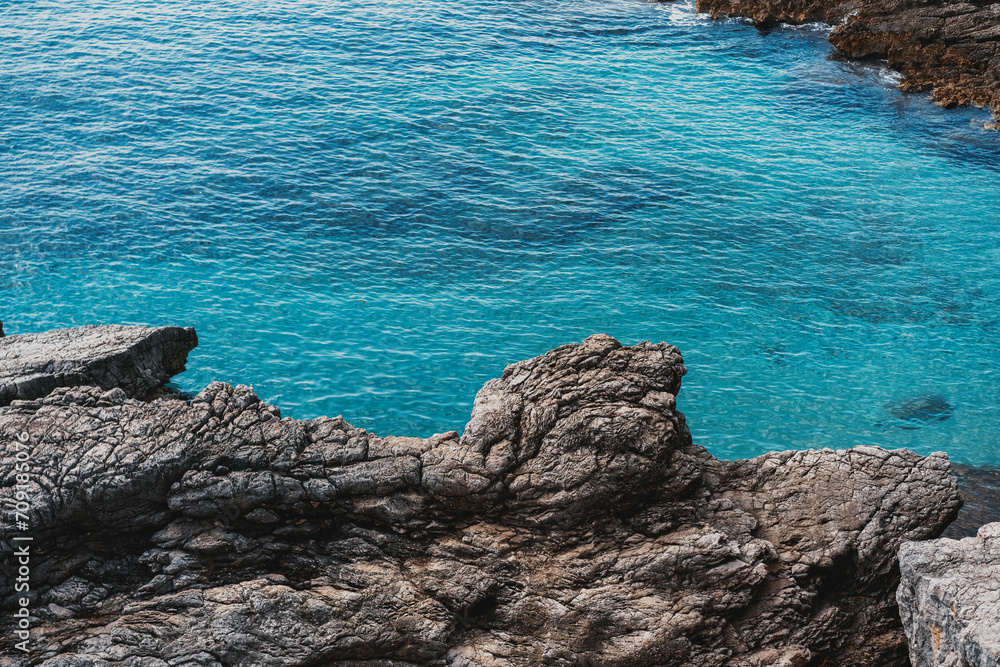 Sea landscape, blue turquoise water in a rocky bay.