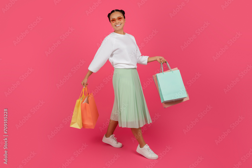 Big Sales. Excited Happy Asian Woman Holding Bright Shopping Bags In Hands Big Sales. Excited Happy Asian Woman Holding Bright Shopping Bags In Hands
