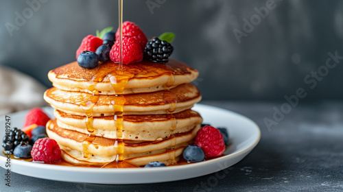 Coconut Flour Pancakes with Fresh Berries and Maple Syrup