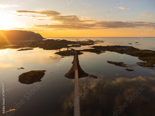 Summer sunset view of Lofoten, Norway scenery from above, with high mountains, fjord of Selfjord, colorful sky and with the famous Fredvang bridges photo