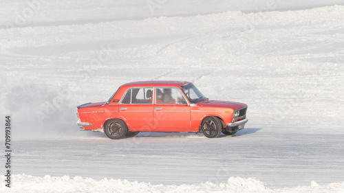 Car at high speed moves on slippery road, icy road, drifting car in freezing weather, car skidding on icy road in frost, Drift car on ice, Auto ice racing, Tinted, Selective Focus, Sun Flare