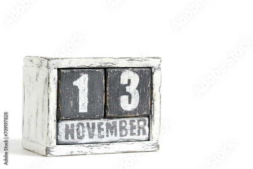 November 13 on wooden calendar, on white background.