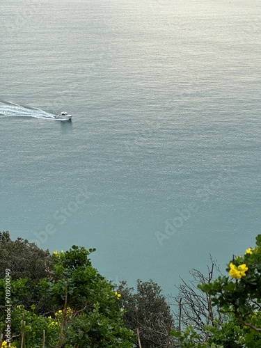 a boat along the coast still water 