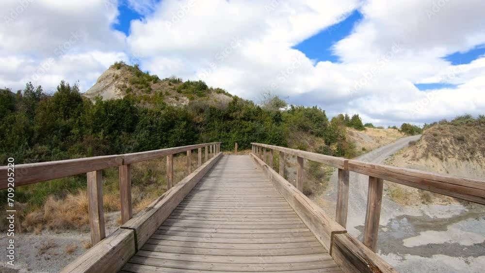 French way through Aragon - a pedestrian bridge over a stream between Martes and Mianos, province of Zaragoza, Aragon, Spain French way through Aragon - a pedestrian bridge over a stream between Martes and Mianos, province of Zaragoza, Aragon, Spain