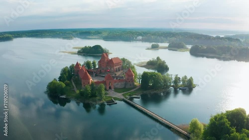 Drone aerial footage of Trakai Castle on sunny summer morning. Lakes, forests and islands around. TRAKAI, LITHUANIA - 07 11 2023. photo