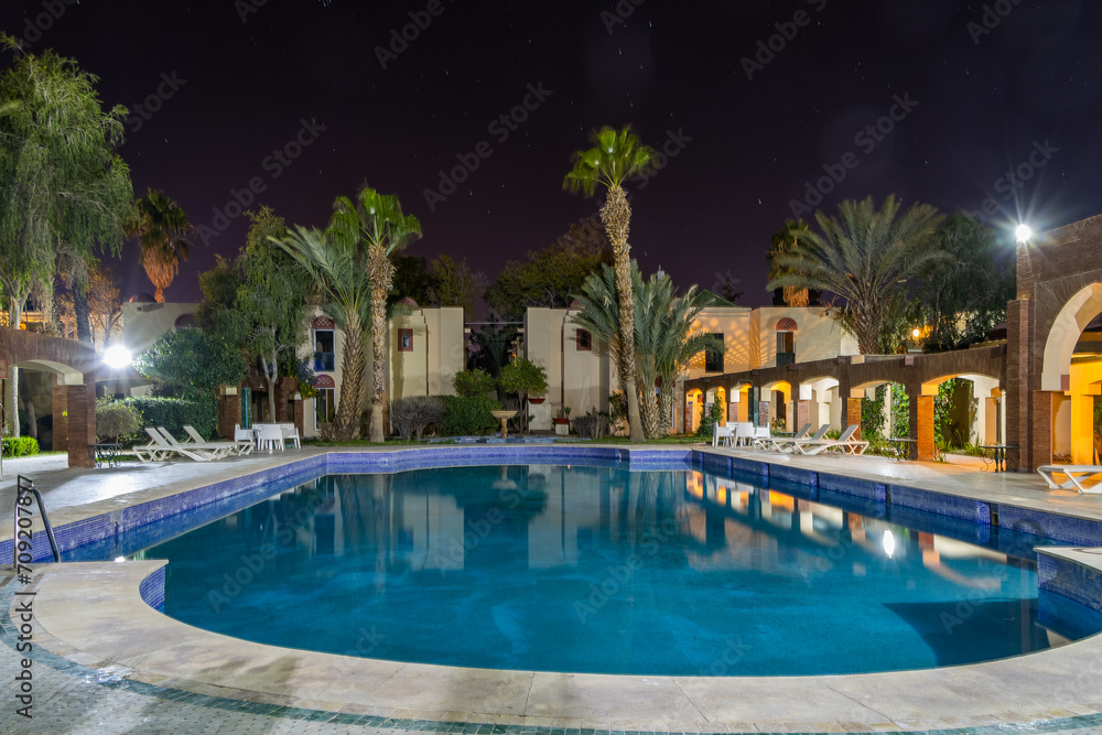 Ouarzazate Morocco. Beautiful city in the atlas mountains of Morocco. Karam Palace Hotel at night.
