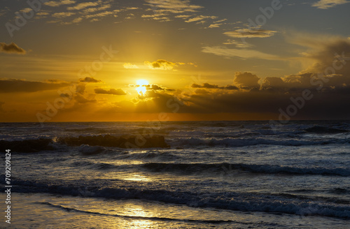 sea against sunset background