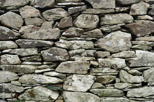 Closeup of very old dry stone wall next to a megalithic archaeological site in the south of Ireland