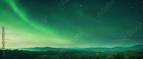 green gradient mystical moonlight sky with clouds and stars © Adi