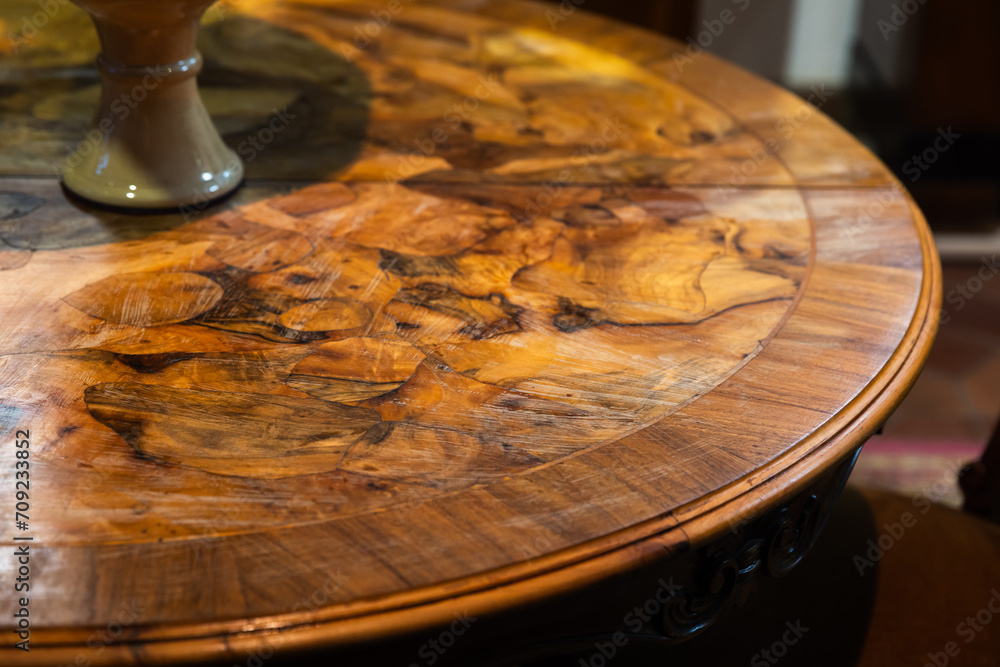 An empty round vintage wooden table, close up photo