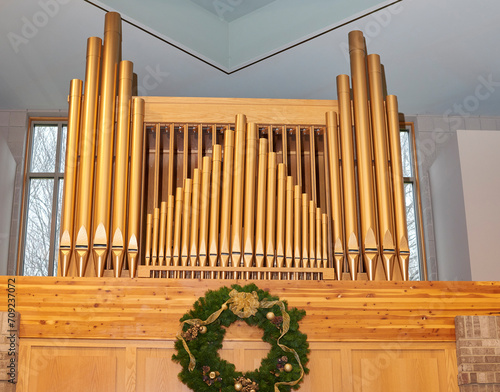 Catholic Church. Pipes of pipe organ in church sanctuary. Above alter