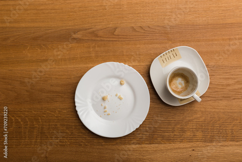 Empty plate and coffee cup after breakfast